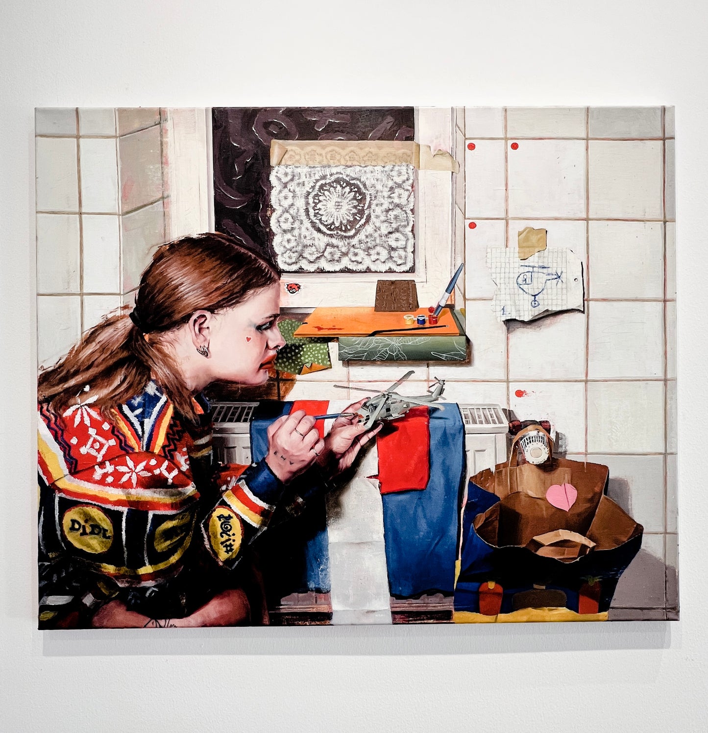 Anya does makeup on a model of the US Seahawk SH-60B Helicopter