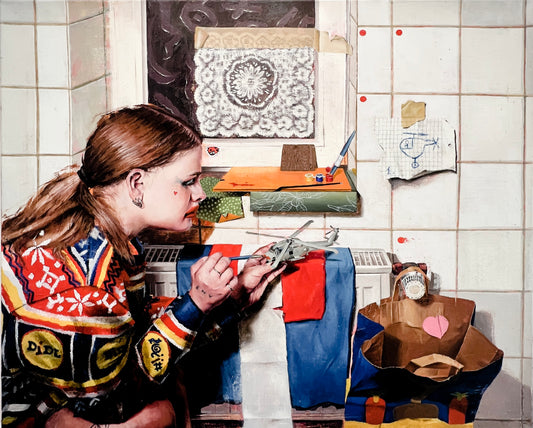 Anya does makeup on a model of the US Seahawk SH-60B Helicopter