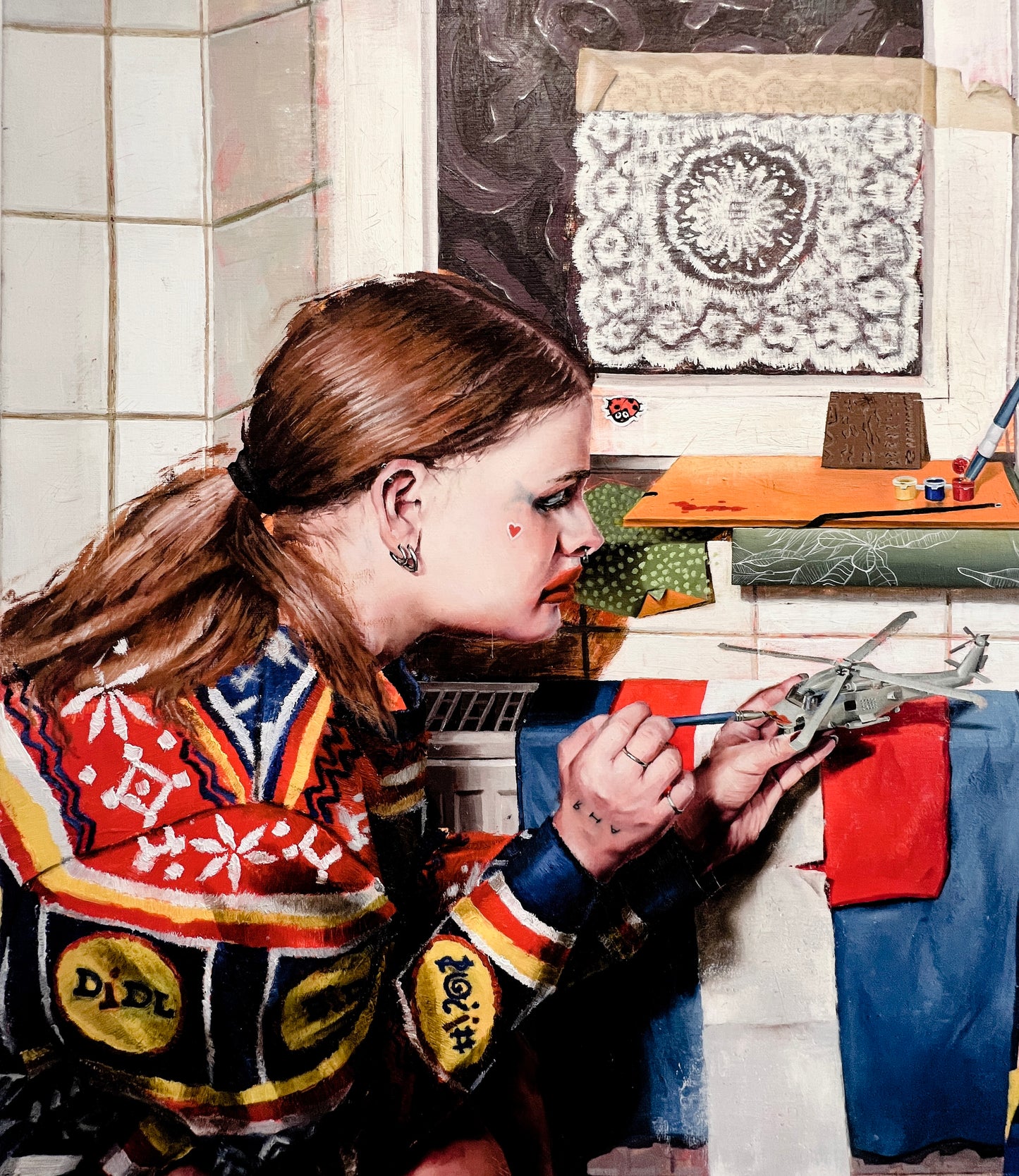 Anya does makeup on a model of the US Seahawk SH-60B Helicopter